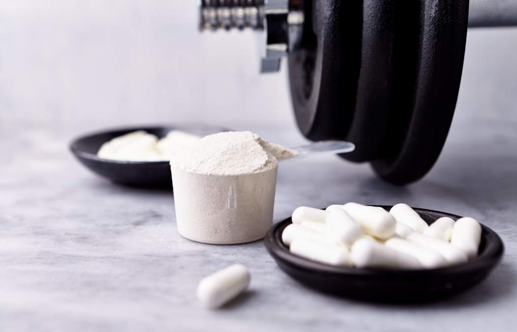 Scoop of creatine on a countertop