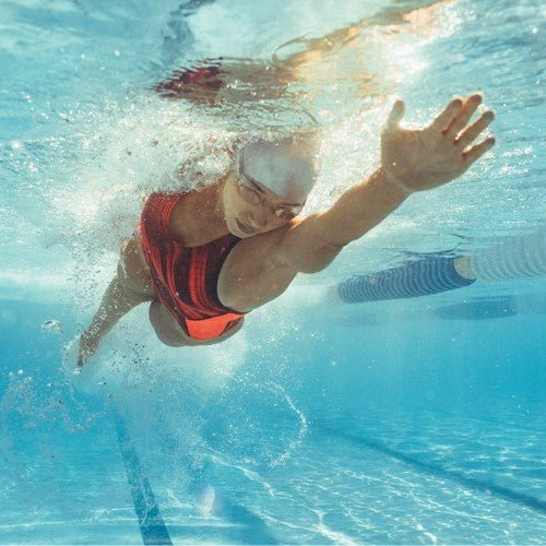 Underwater shot of athlete swimming in a pool. 
